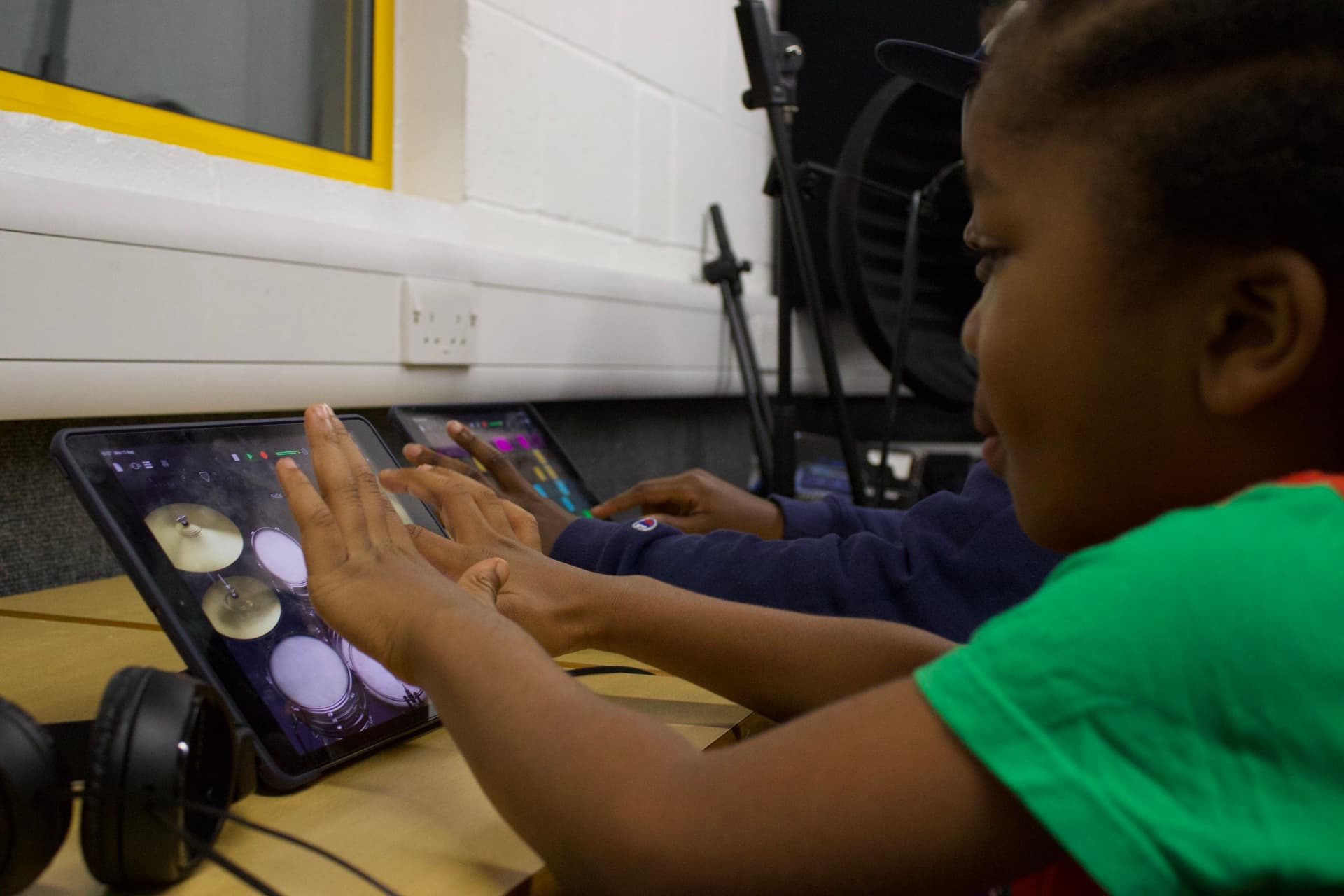 Student using iPad for music production at a Kynda Learning workshop
